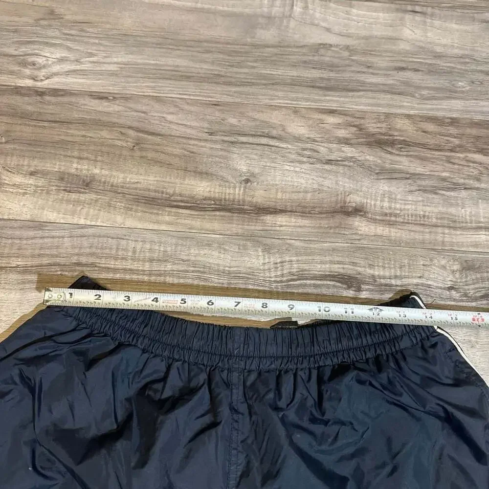Vintage Men's Navy Blue Nylon Track Pants with White Side Piping and Zip Cuffs